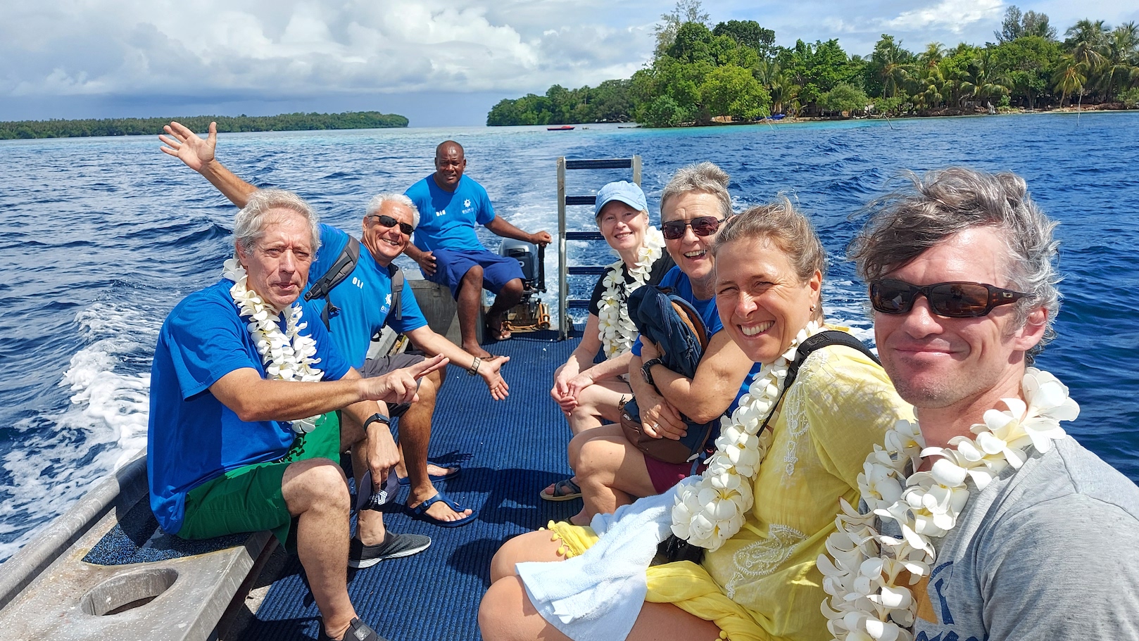 A group of divers coming back from a village visit in the Solomon Islands